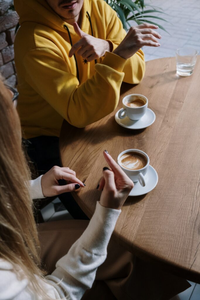 Photo by cottonbro studio: https://www.pexels.com/photo/man-and-woman-communicating-through-hand-sign-6321931/